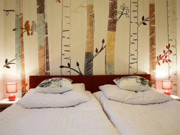 Sypialnia w apartamencie Szum Lasu 