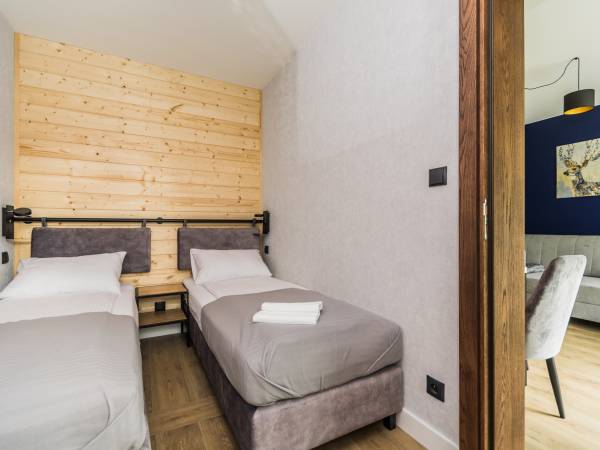 Gajówka - Całoroczne Pokoje i Apartamenty