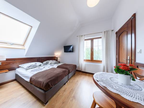 Pokoje i domki przy Leśniczówce