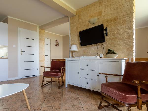 Apartamenty i Pokoje nad brzegiem jeziora Tałty