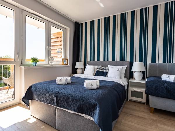 Apartament z balkonem-sypialnia