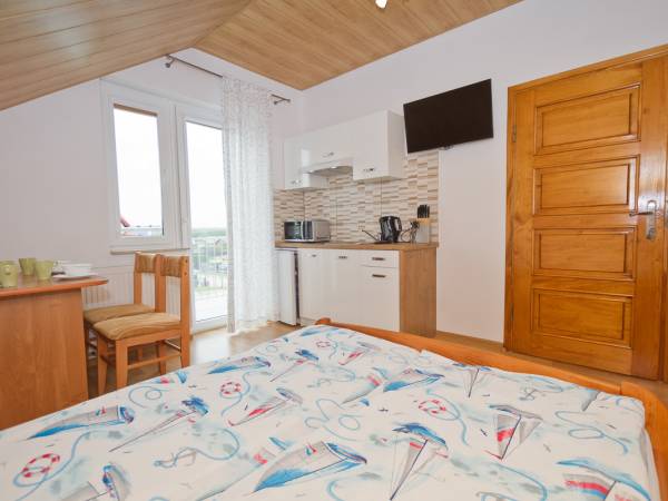 Pokój 4 -osobowy typu studio z aneksem kuchennym