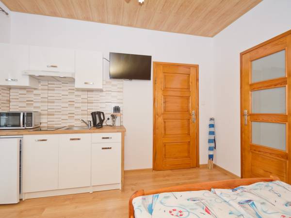 Pokój 4 -osobowy typu studio z aneksem kuchennym