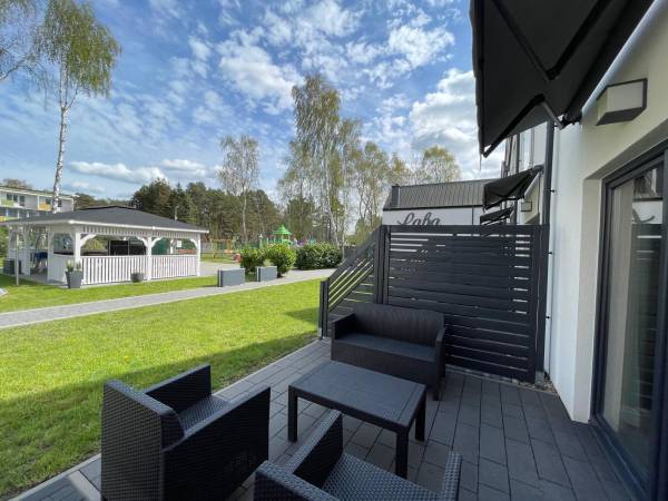 Tarasy z widokiem na patio i altanę